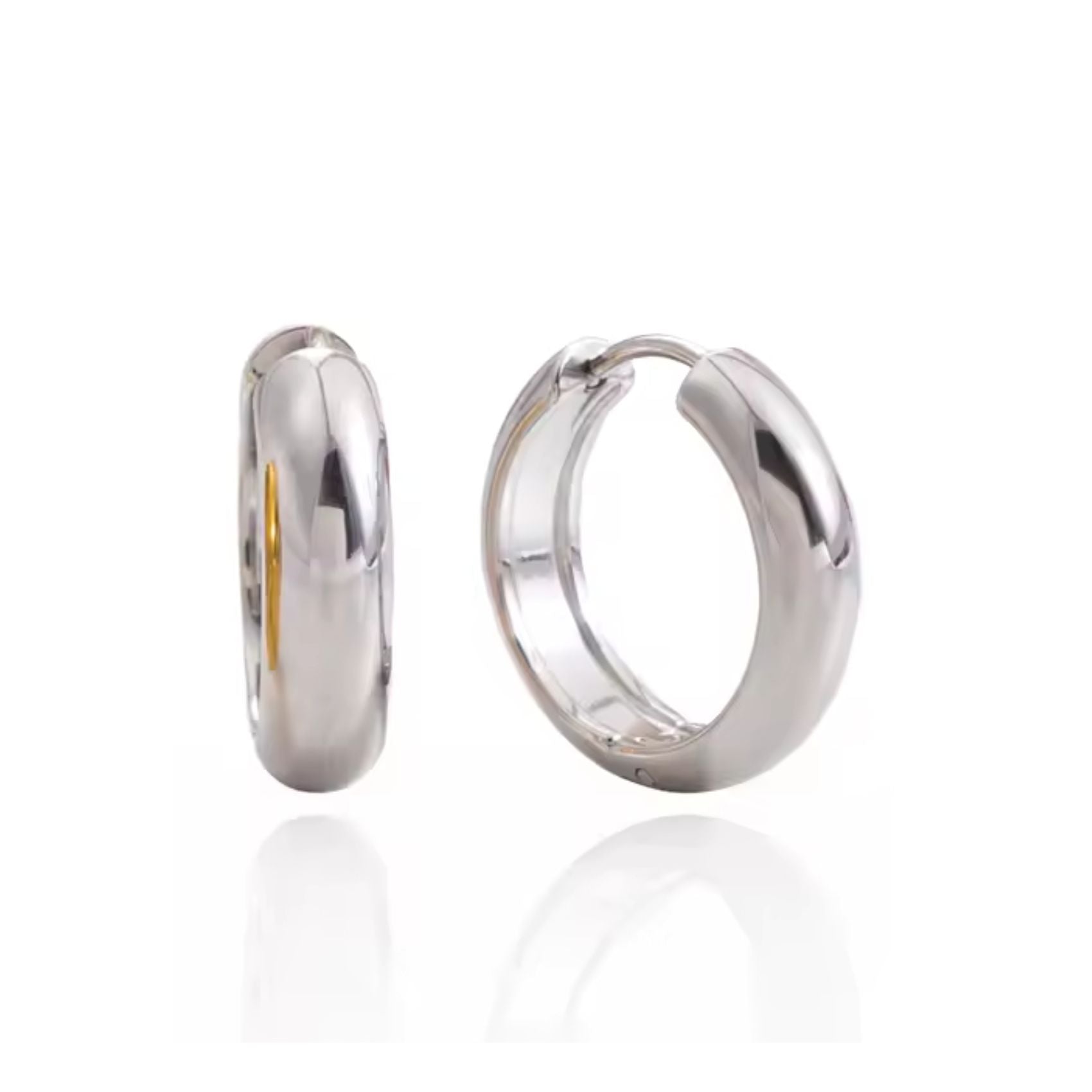 A pair of polished silver hoop earrings shown on a clean white background, with one earring standing upright and the other lying flat to display the side profile.