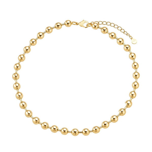 Gold beaded bracelet on a white background