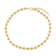 Gold beaded bracelet on a white background