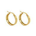 Gold hoop earrings on a white background