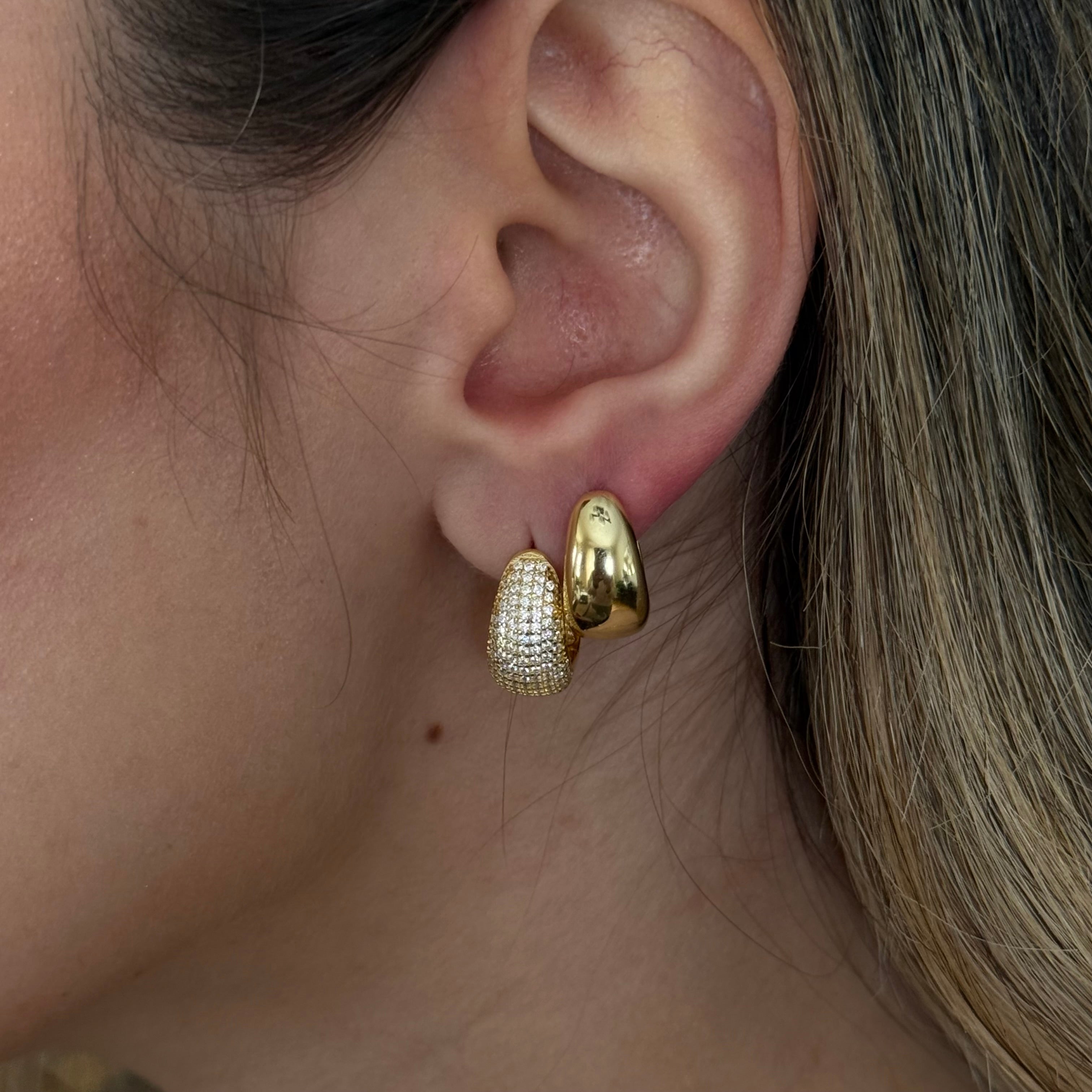 Puffy pavé dome hoop earrings worn by model, bold and glamorous