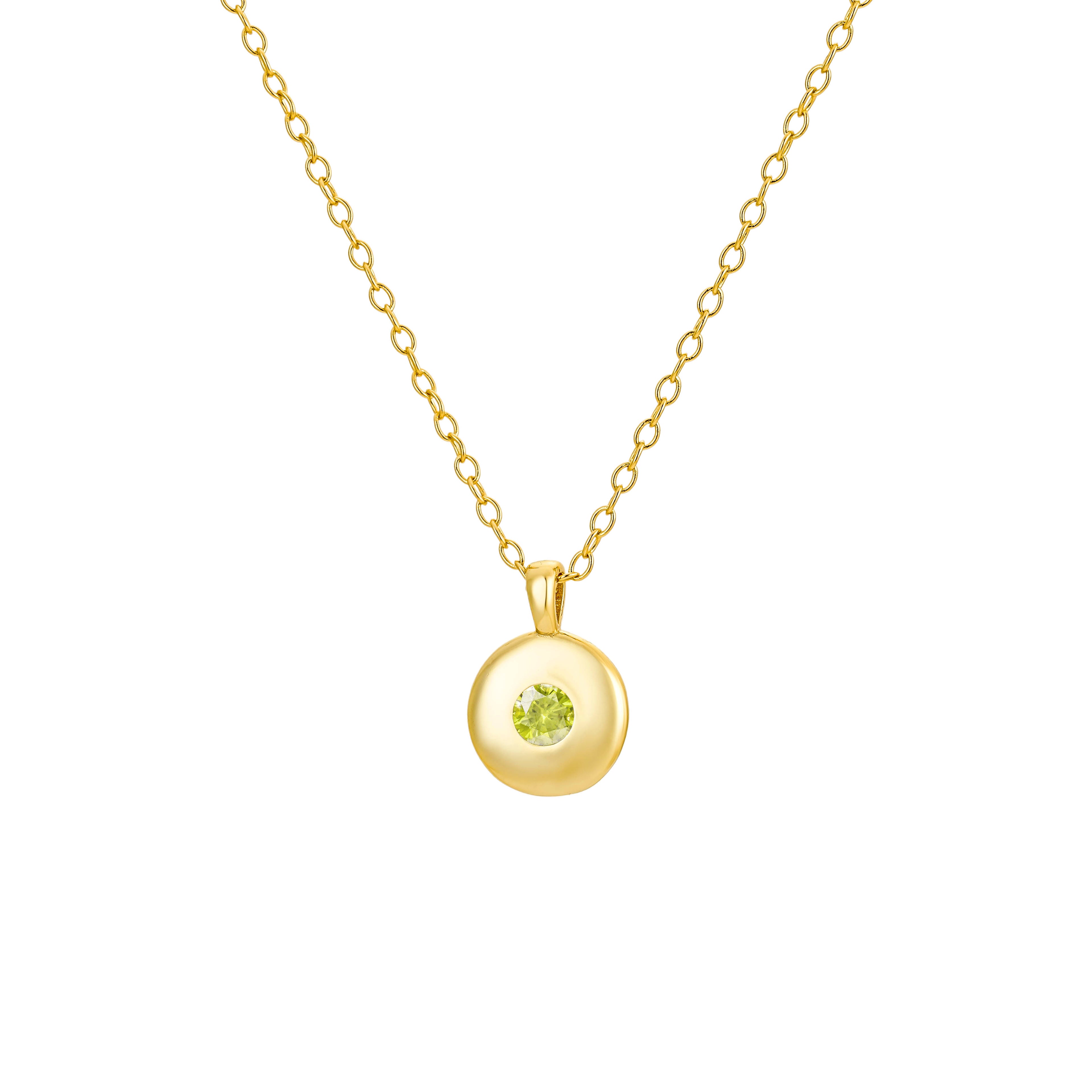 Gold round pendant necklace featuring a vibrant green peridot gemstone