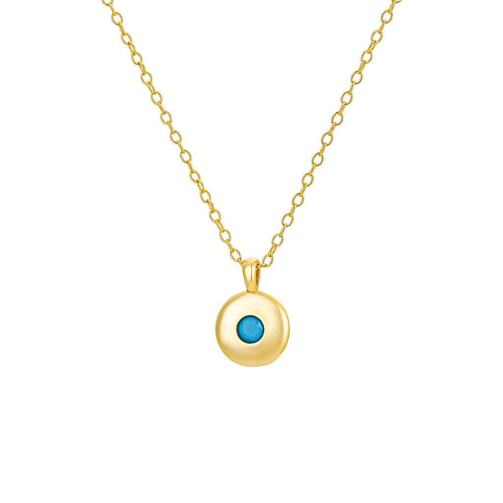 Gold round pendant necklace featuring a vibrant turquoise stone