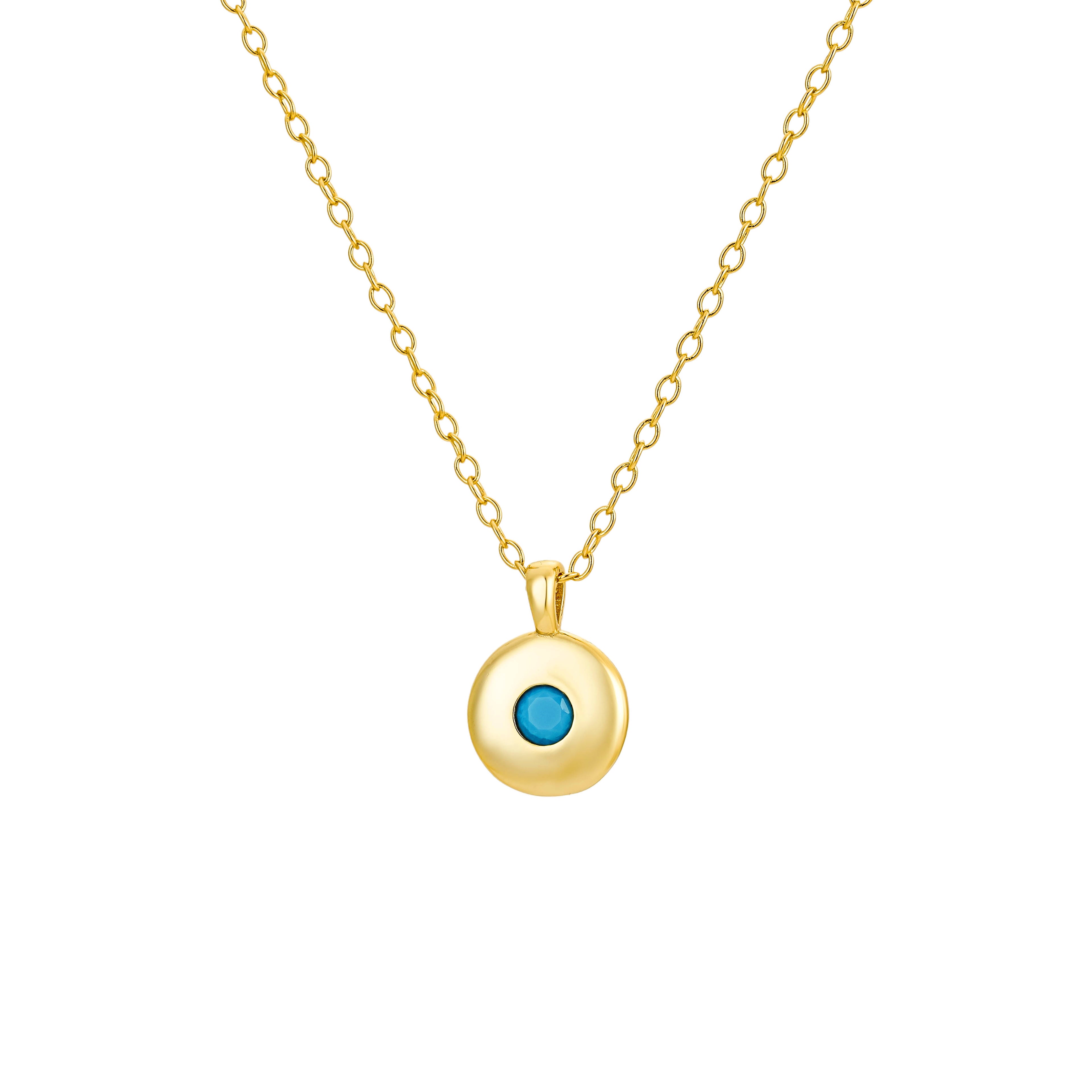 Gold round pendant necklace featuring a vibrant turquoise stone