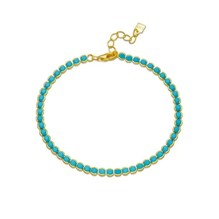 Dainty gold bezel bracelet featuring a vibrant turquoise stone