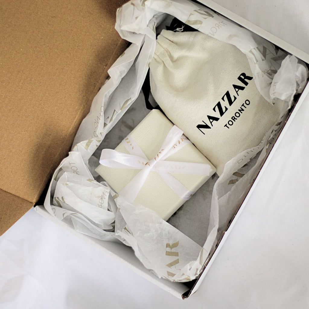 Minimalist white jewelry box with ribbon, perfect for gifting